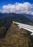 Flying over mountains and winding roads.