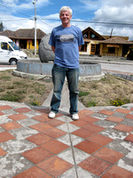 Standing astride the equator in Ecuador.